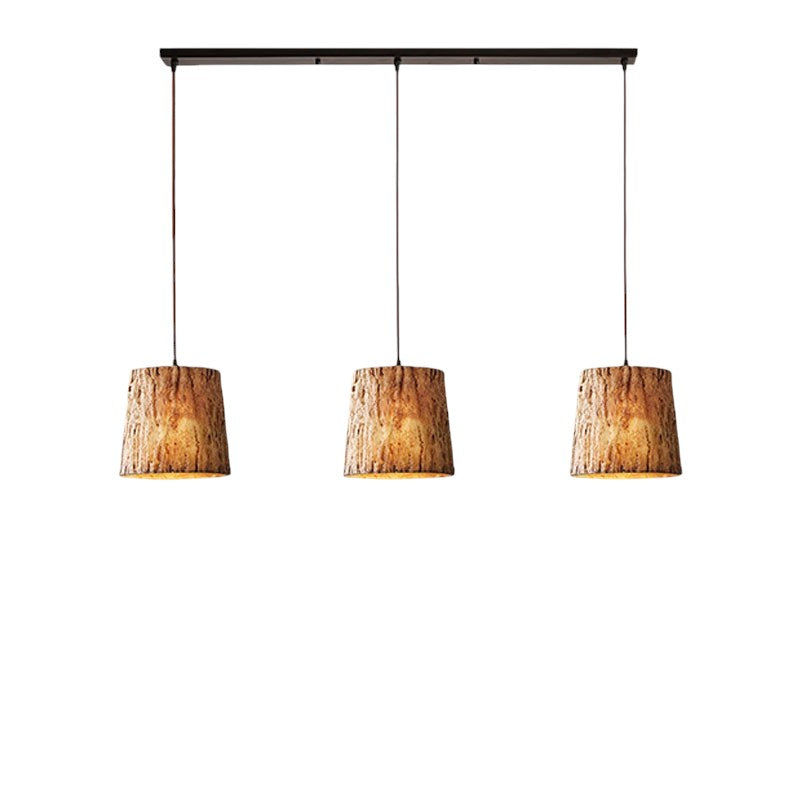 Lampada a sospensione in tronchi di legno
