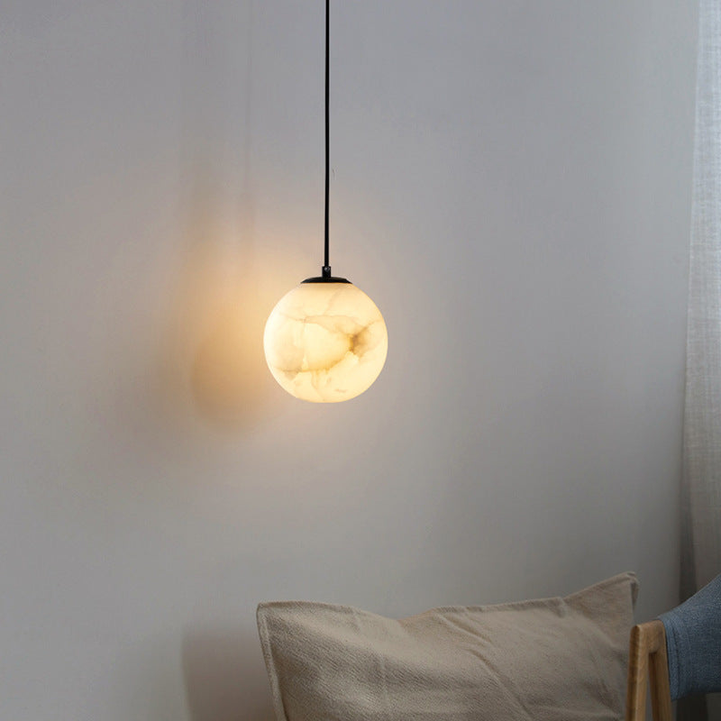 Lampada sospesa in marmo sferico